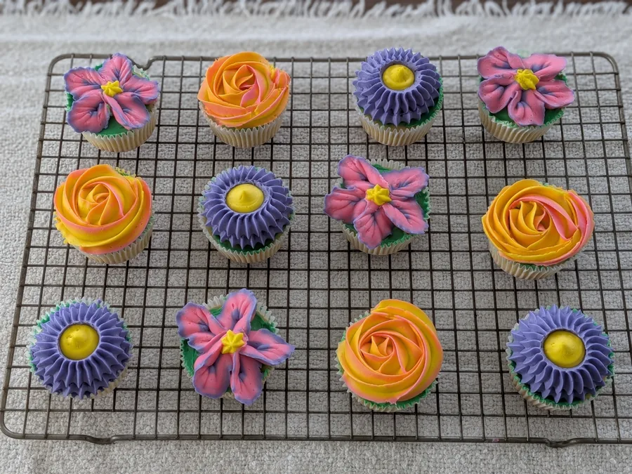 Colorful cupcakes decorated with piped flowers